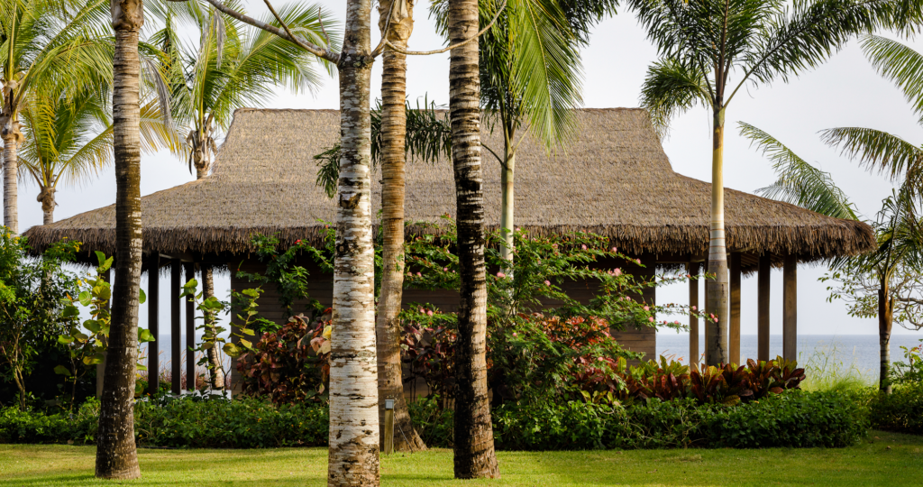 Ocean-view thatched pavilion at Casa Loro Panama with Endureed bespoke engineered thatch roofing, wide-span custom synthetic thatch blend on open-air beachfront structure Pedasi Panama