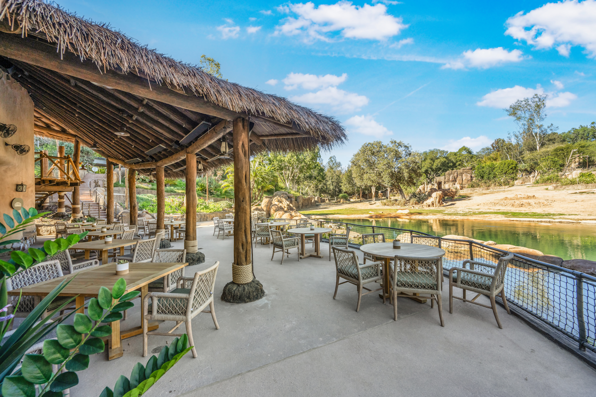 Endureed synthetic thatch canopy over outdoor dining terrace at Elephant Valley San Diego Safari Park, engineered thatch roofing for commercial hospitality and zoo dining venue design