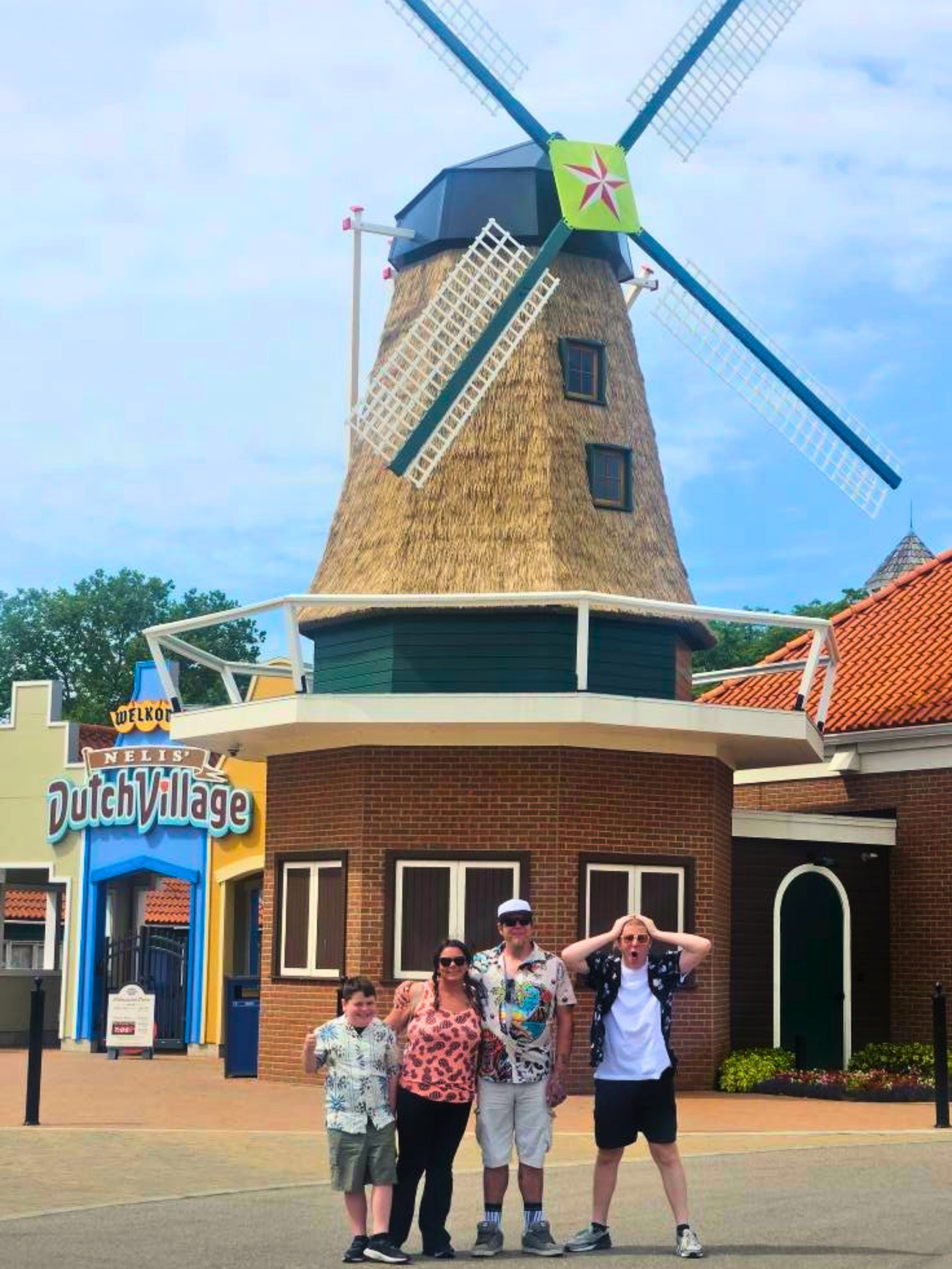 Endureed Somerset engineered thatch on Nelis Dutch Village windmill Holland Michigan, premium synthetic thatch cladding on iconic theme park landmark with visitors, durable thatch for high-traffic family entertainment venues