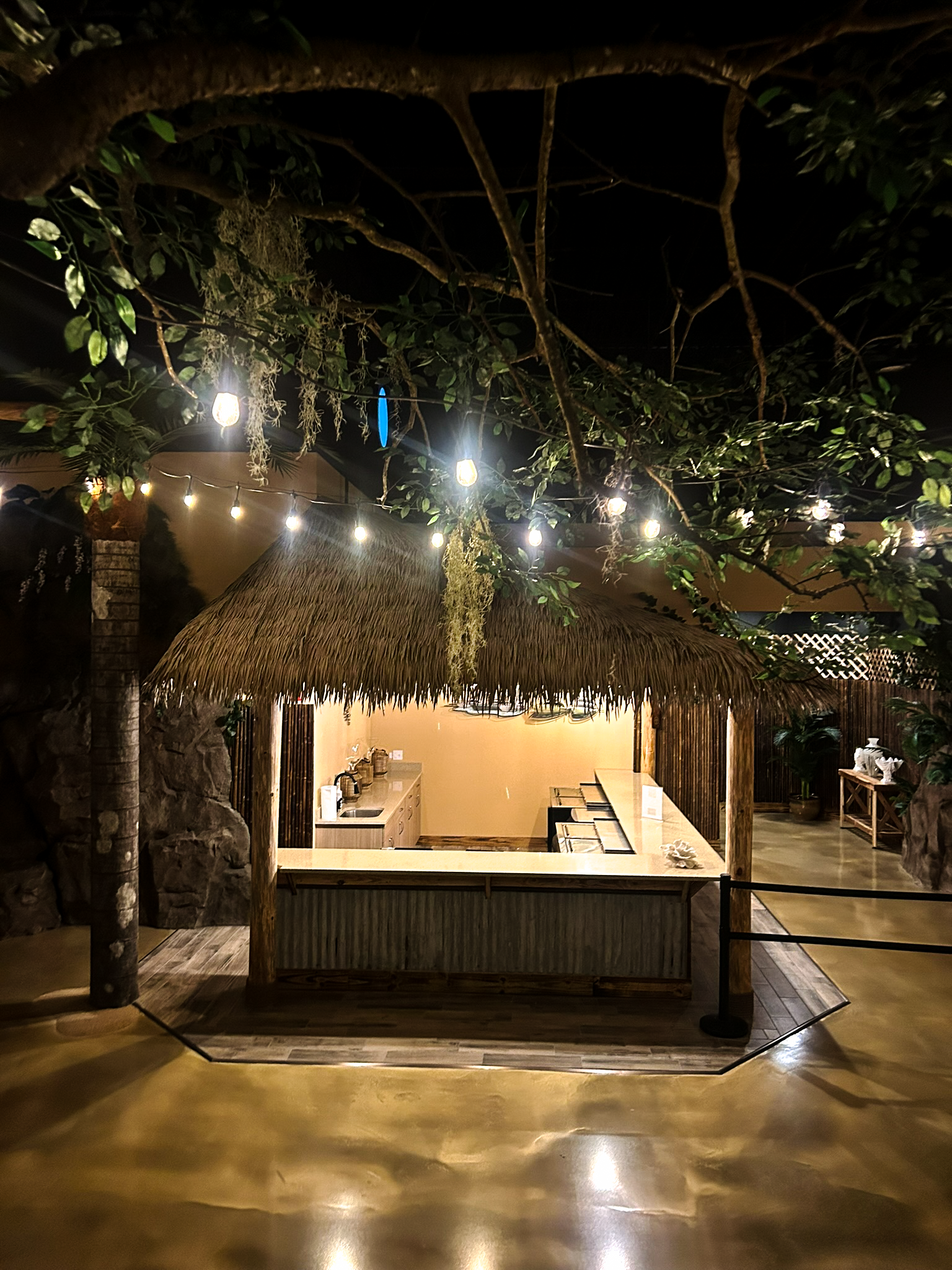 Indoor palapa bar with engineered thatch roofing for commercial hospitality