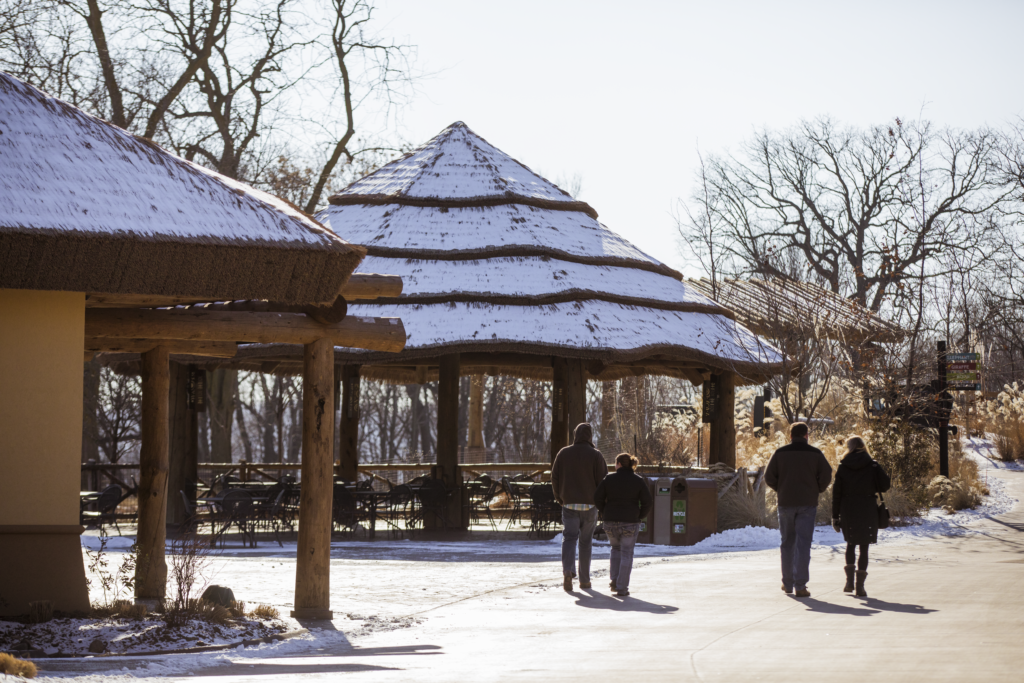 Omaha Zoo exhibit building with Endureed Premium Capetown synthetic thatch roof in winter, mid-range snow covered view