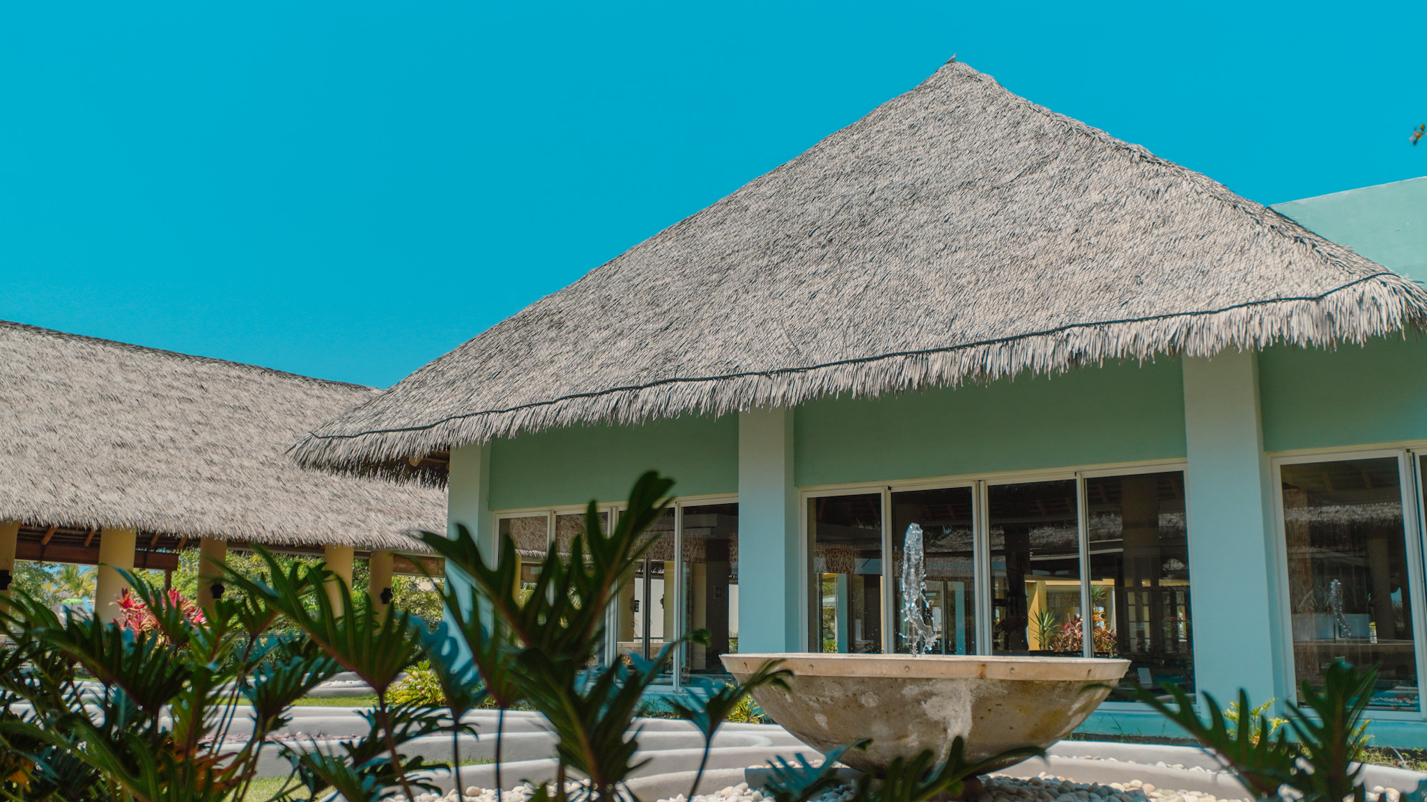 Synthetic thatch architectural detail luxury resort installation Performance Weathered Palm Endureed Playa Mita Mexico