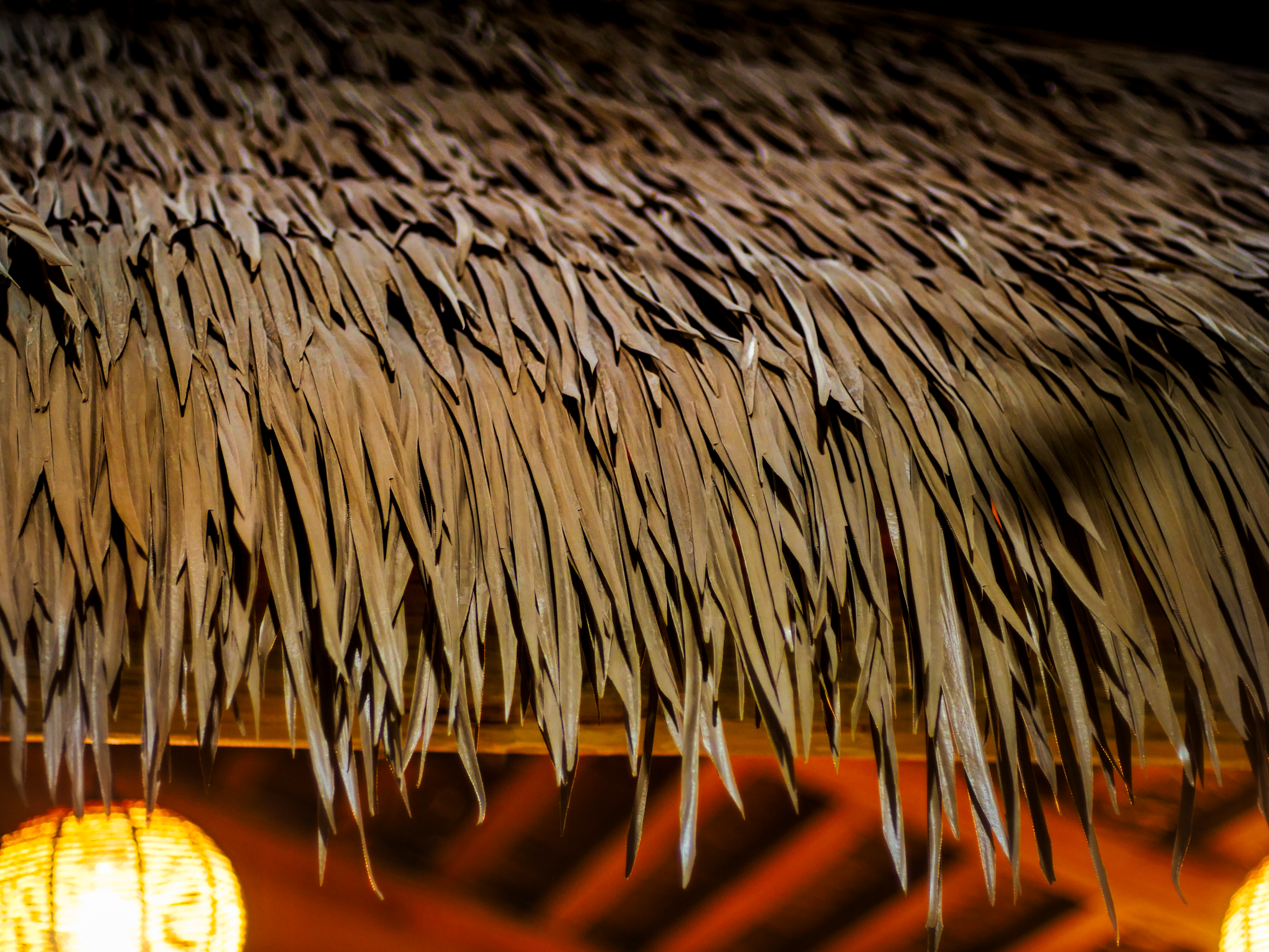 Engineered thatch frond detail close-up showing texture and craftsmanship
