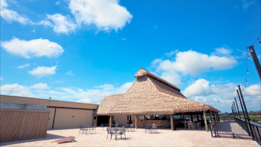 Engineered performance palm thatch roofing on large commercial tiki hut &mdash; Endureed Thatch, Florida entertainment venue