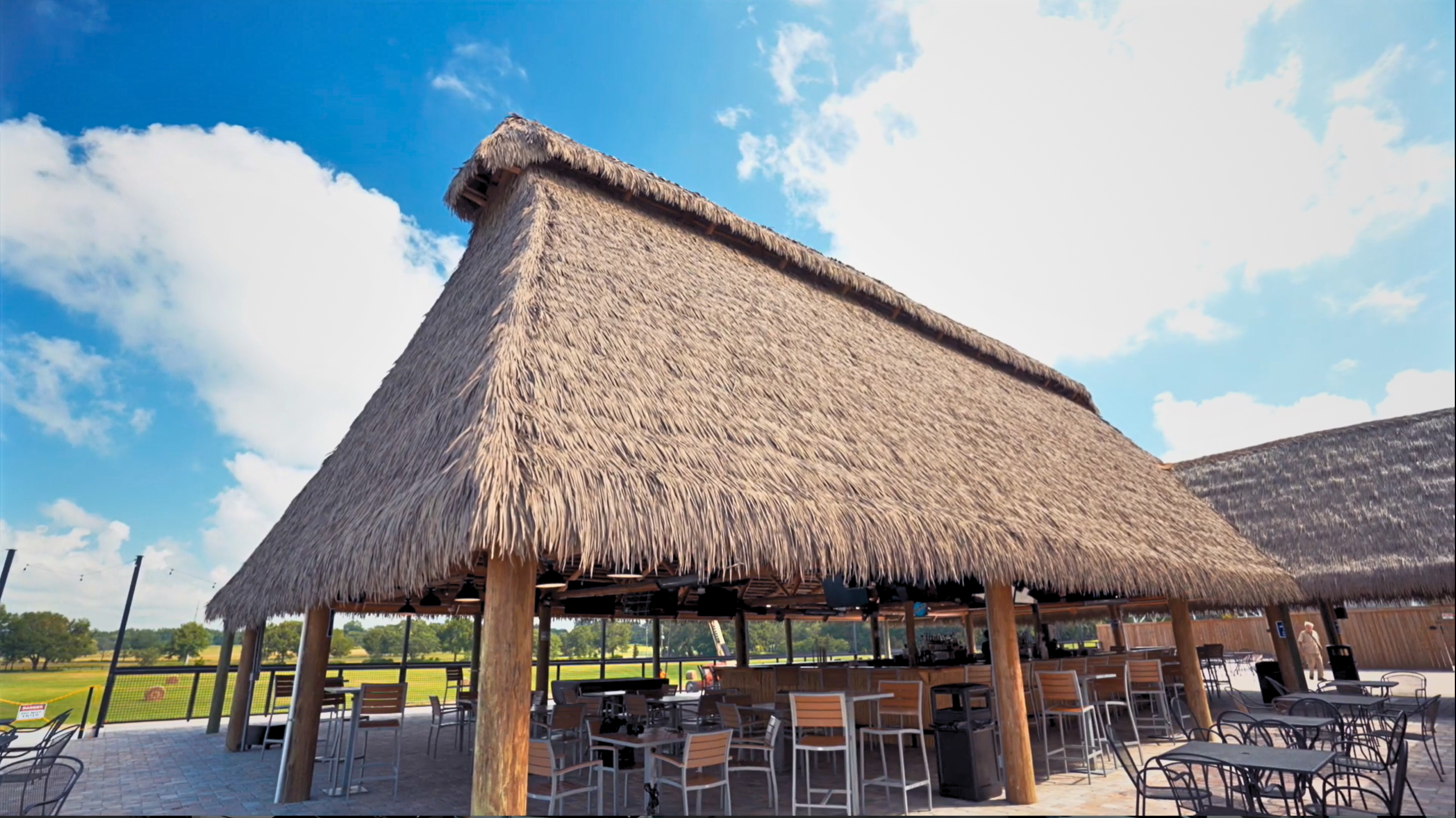 Oxford Downs tiki bar with Endureed synthetic thatch roof and outdoor patio seating, Summerfield Florida