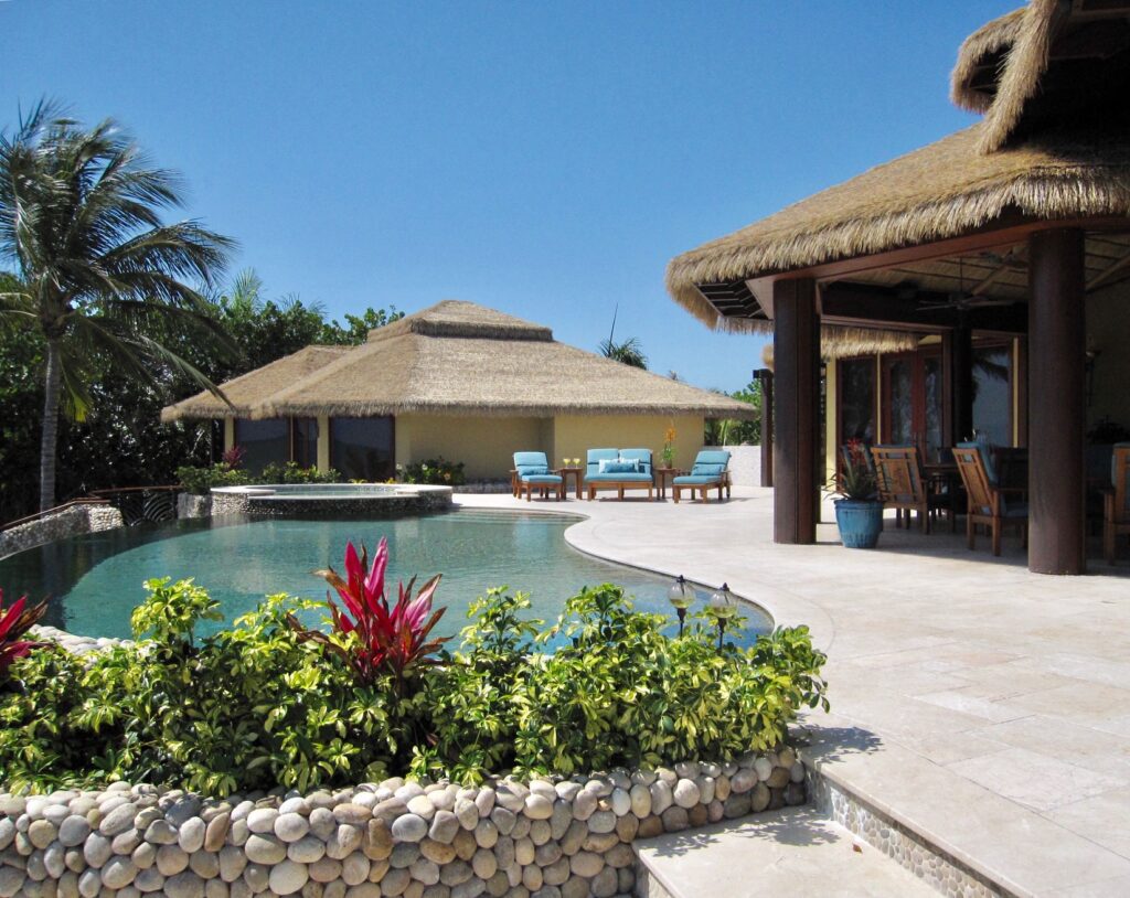 Florida beachfront home with Endureed Premium Bali synthetic thatch roofing, full exterior view