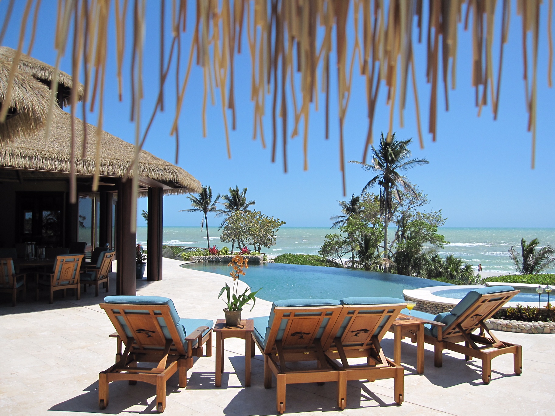 Beachfront home on Sanibel Island featuring Endureed Premium Bali engineered thatch roofing, residential exterior