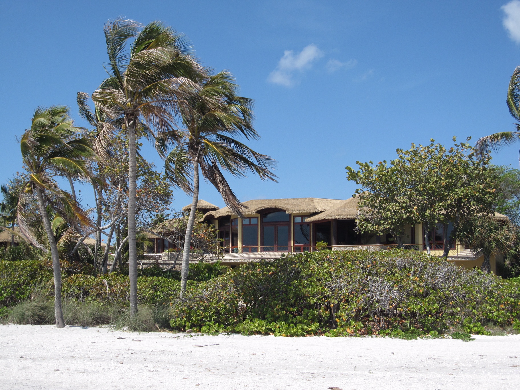 Beachfront home on Sanibel Island featuring Endureed Premium Bali engineered thatch roofing, residential exterior