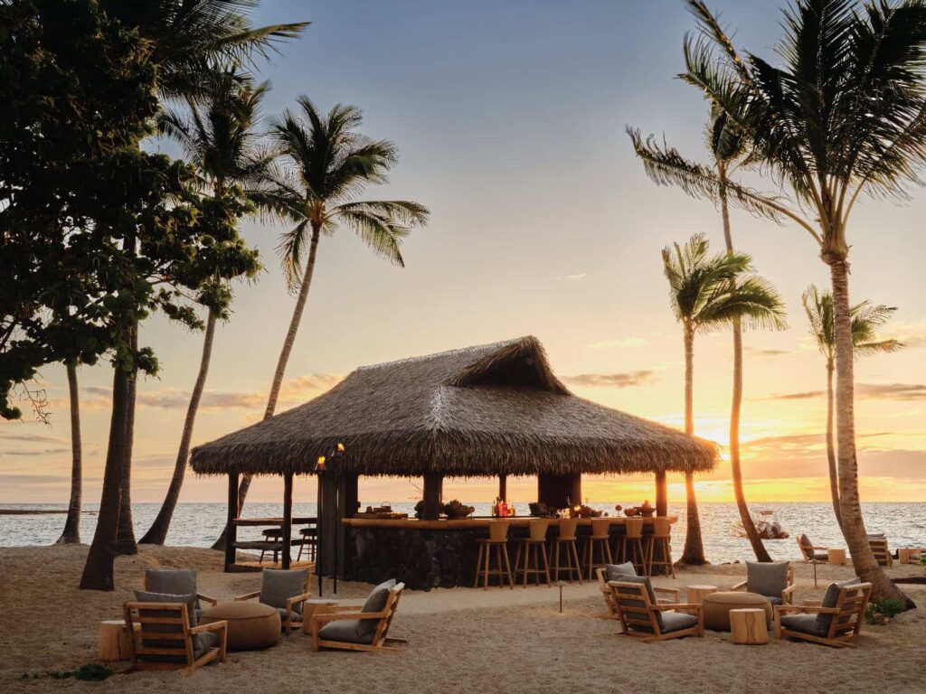 Outdoor beach bar with Endureed engineered thatch at Kona Village Resort, Hawaii at sunset
