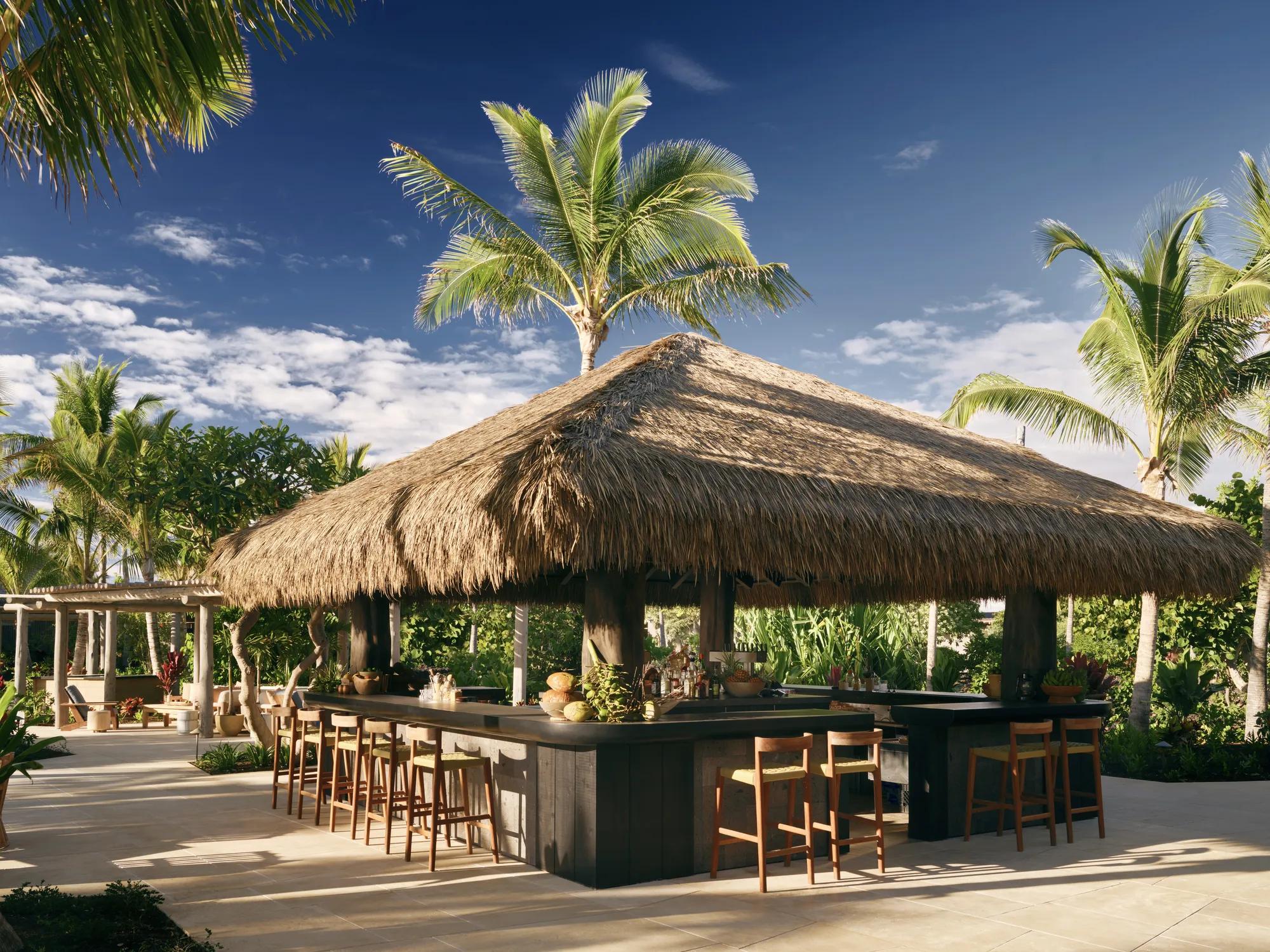 Kona Village's open-air bar beneath a custom engineered thatch roof
