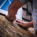 In defense of ancient craft close up on window engineered thatch install
