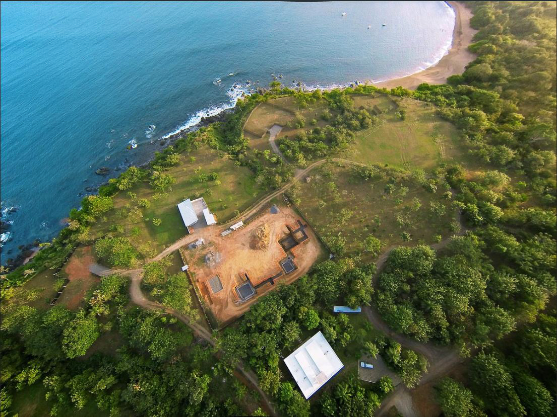 Aerial view of Casa Loro groundbreaking in 2015, foundation work beginning on the oceanfront site in Pedasi, Panama before construction of the IM/KM Architecture pavilions