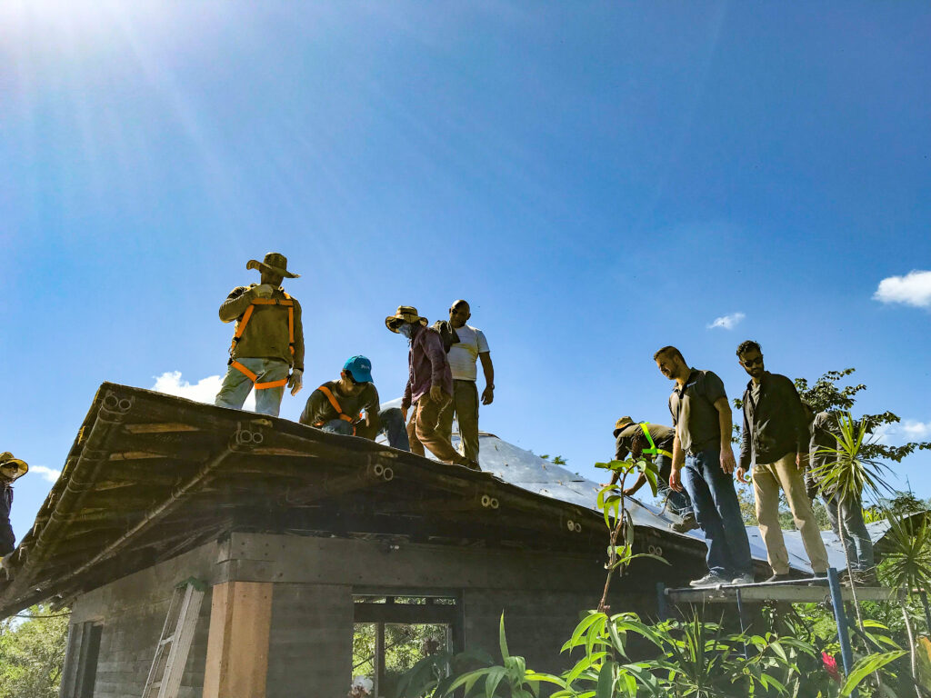 Casa Loro roof crew and Endureed's Luke Sparks inspecting zinc sheeting over bamboo framing during construction in Pedasi, Panama
